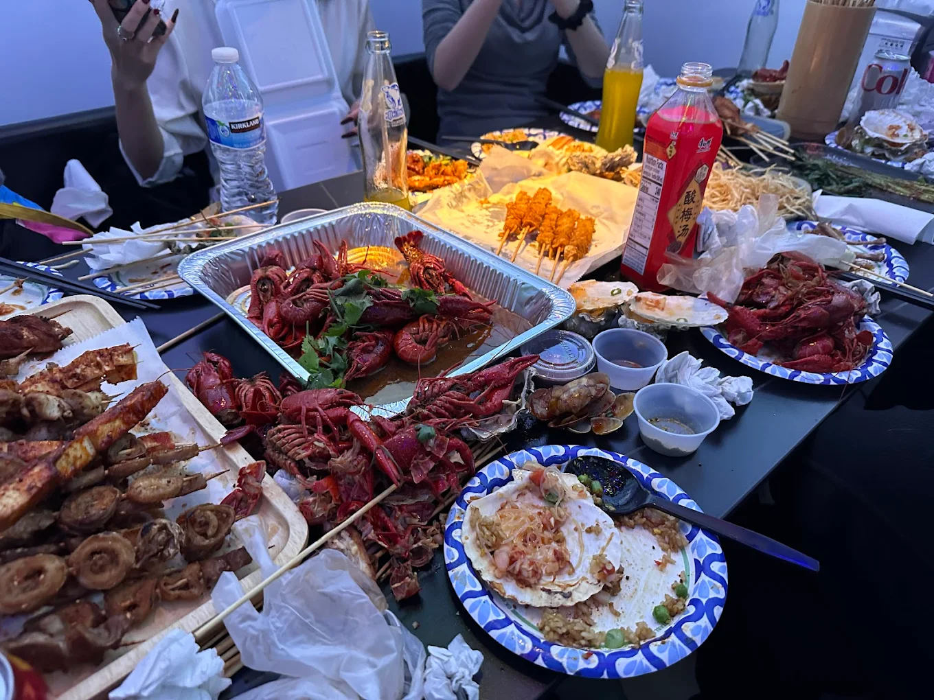 Assorted crayfish, skewers and seafood dishes at Xinjiang BBQ, a Barbecue Restaurant in San Diego